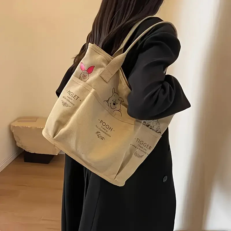 The Mesuca Women Large Capacity Canvas Tote Bag Multi‑pocket Cartoon Animal Print Handbag Casual Shoulder Bag Daily Work Shopping Purse