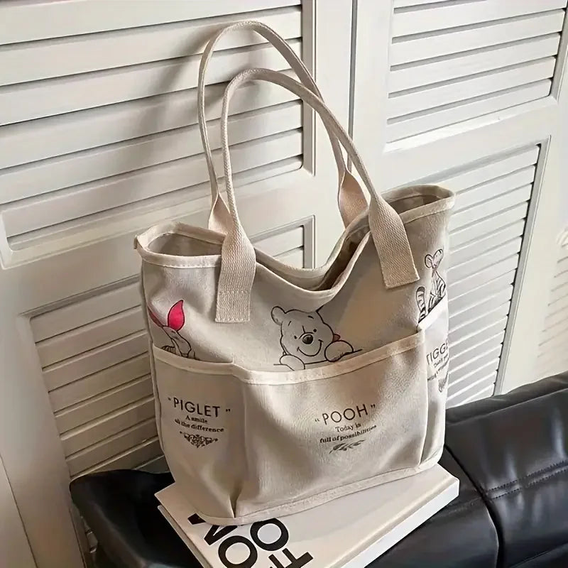 The Mesuca Women Large Capacity Canvas Tote Bag Multi‑pocket Cartoon Animal Print Handbag Casual Shoulder Bag Daily Work Shopping Purse