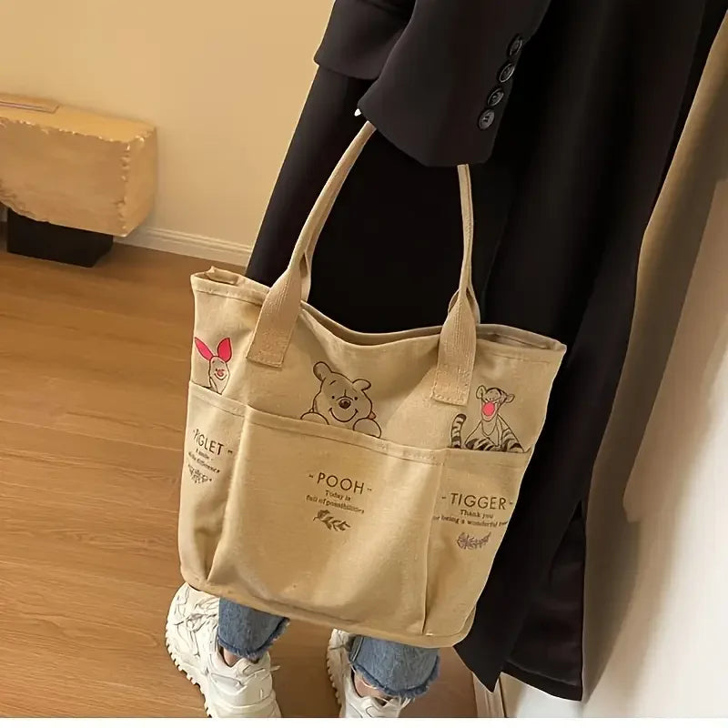 The Mesuca Women Large Capacity Canvas Tote Bag Multi‑pocket Cartoon Animal Print Handbag Casual Shoulder Bag Daily Work Shopping Purse