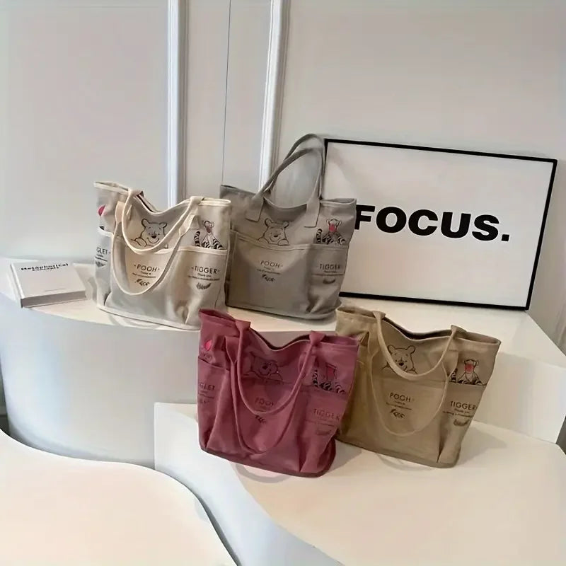 The Mesuca Women Large Capacity Canvas Tote Bag Multi‑pocket Cartoon Animal Print Handbag Casual Shoulder Bag Daily Work Shopping Purse
